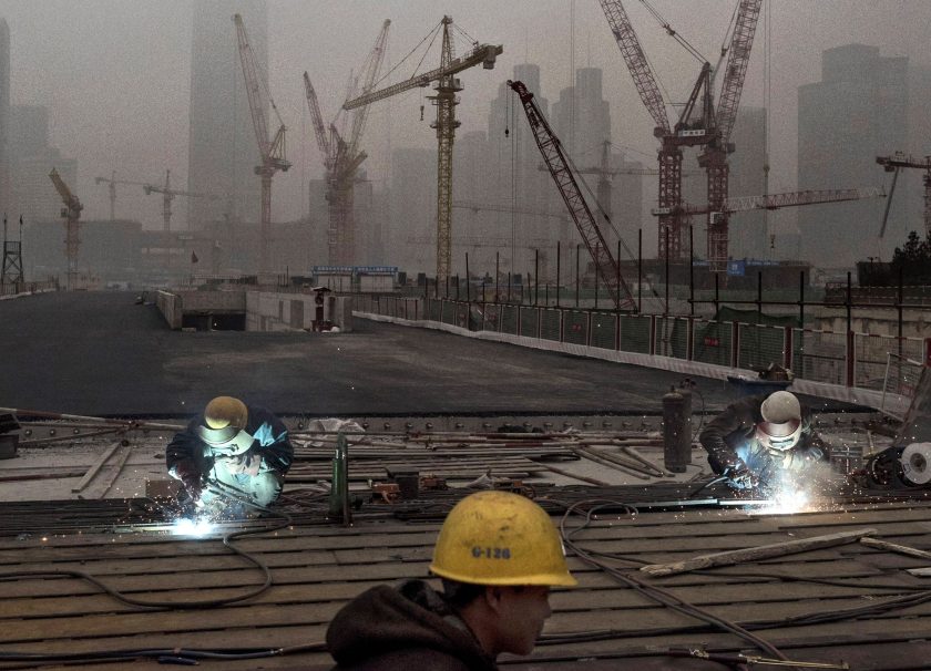 Chinese workers weld at a construction site in heavy pollution on November 29, 2014 in Beijing, China. United States President Barack Obama and China's president Xi Jinping agreed on a plan to limit carbon emissions by their countries, which are the world's two biggest polluters, at a summit in Beijing earlier this month. (Kevin Frayer/Getty Images)