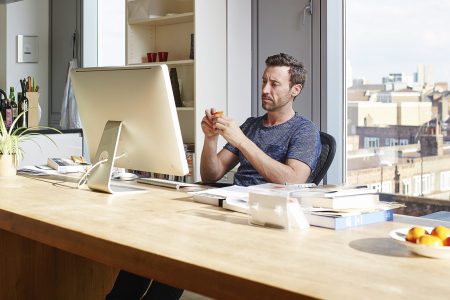 Man working alone in his apartment (Getty Images)