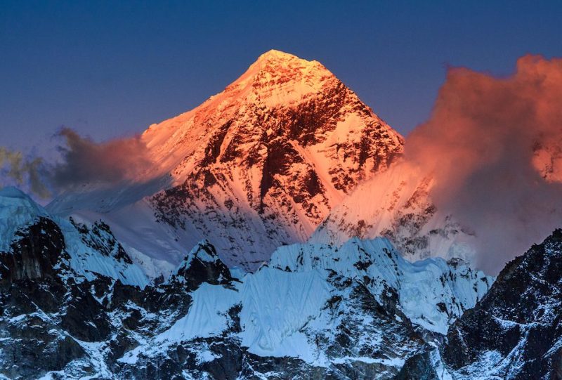 Sunset light over the majestic peak of Mount Everest, the highest mountain in the world, as seen on top of Gokyo Ri, by Gokyo village in Sagarmatha National Park, UNESCO World Heritage Site in Khumbu region, Solukhumbu district, eastern Nepal, Asia.