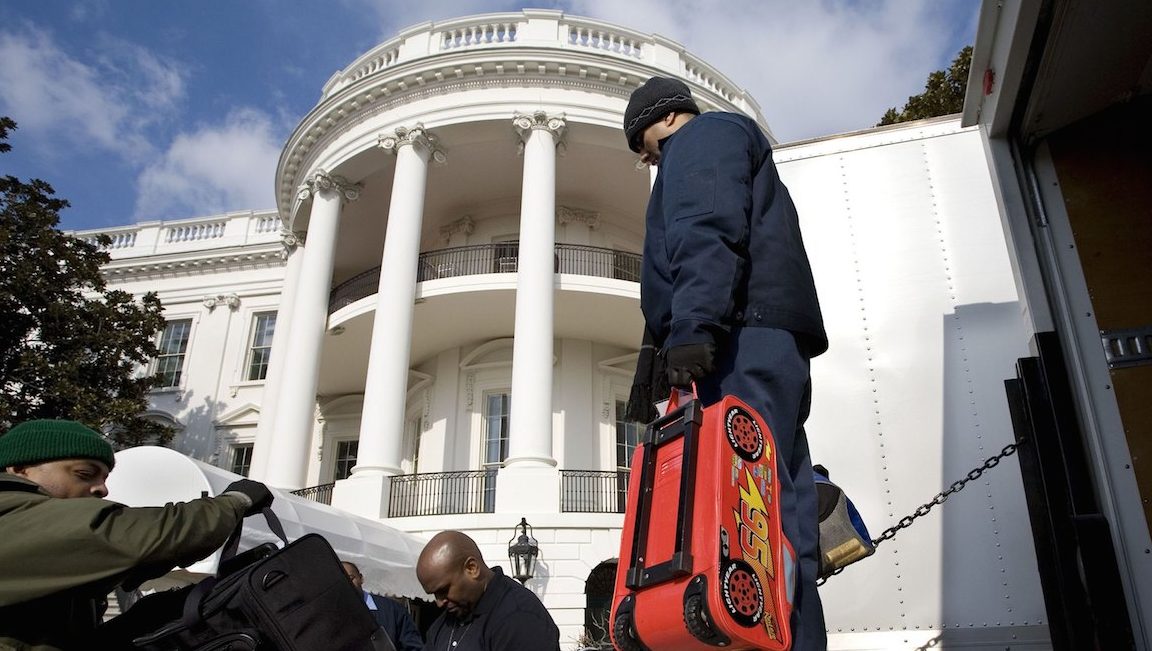 WASHINGTON - JANUARY 20:  *** EXCLUSIVE *** While Barack Obama is being sworn in as the 44th president of the United States of America at the U.S. Capitol, his family's possessions, including one of his daughter's bags, are unloaded from moving trucks and put in place in the White House living quarters on January 20, 2009 in Washington, DC. Obama leads as the first African-American president of the U.S. (Photo by David Hume Kennerly/Getty Images)