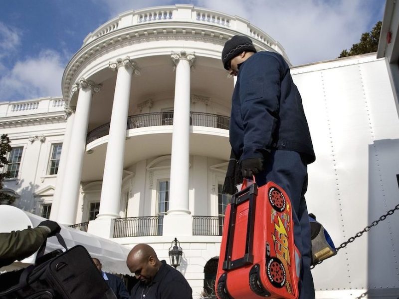 WASHINGTON - JANUARY 20: *** EXCLUSIVE *** While Barack Obama is being sworn in as the 44th president of the United States of America at the U.S. Capitol, his family's possessions, including one of his daughter's bags, are unloaded from moving trucks and put in place in the White House living quarters on January 20, 2009 in Washington, DC. Obama leads as the first African-American president of the U.S. (Photo by David Hume Kennerly/Getty Images)