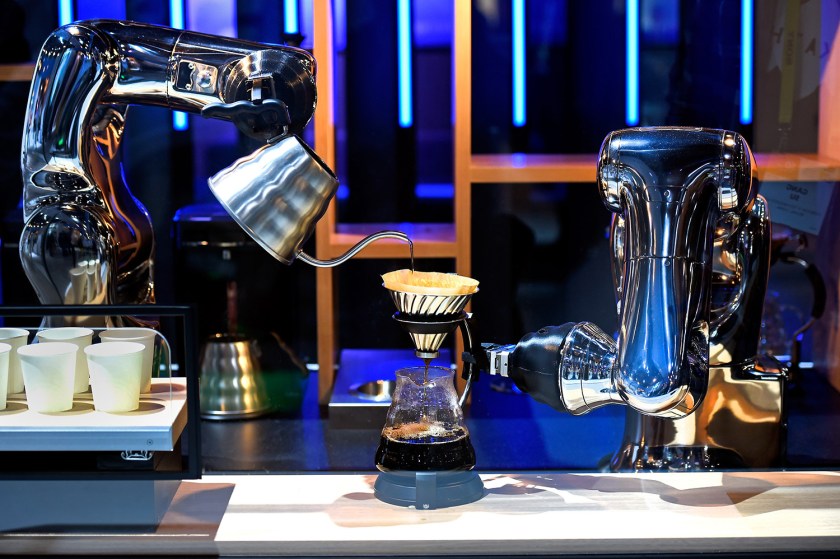 Robotic arms make coffee in a demonstration using a pair of VS-S2 Series robots at the Denso booth at CES 2017 at the Las Vegas Convention Center on January 5, 2017 in Las Vegas, Nevada. CES, the world's largest annual consumer technology trade show, runs through January 8 and features 3,800 exhibitors showing off their latest products and services to more than 165,000 attendees. (David Becker/Getty Images)