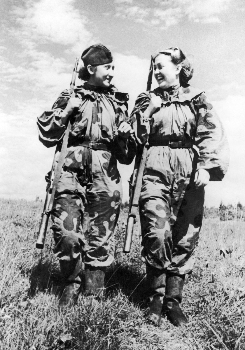 Volunteer women snipers of the Russian Army R. Skrypnikova (right) and O. Bykova returning from a combat assignment during the Second World War on November 21, 1943. (Daily Mirror Library/Mirrorpix/Mirrorpix via Getty Images)