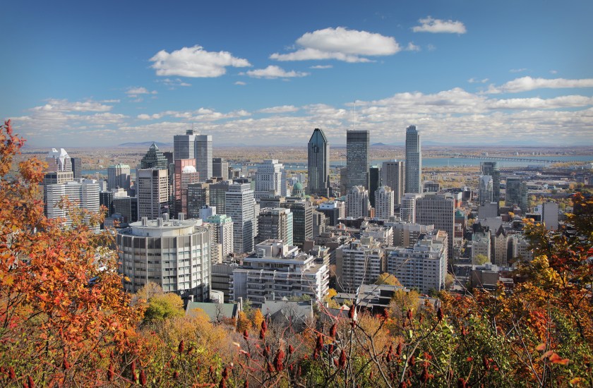 Fall trees with Montreal skyline in background (Getty Images)