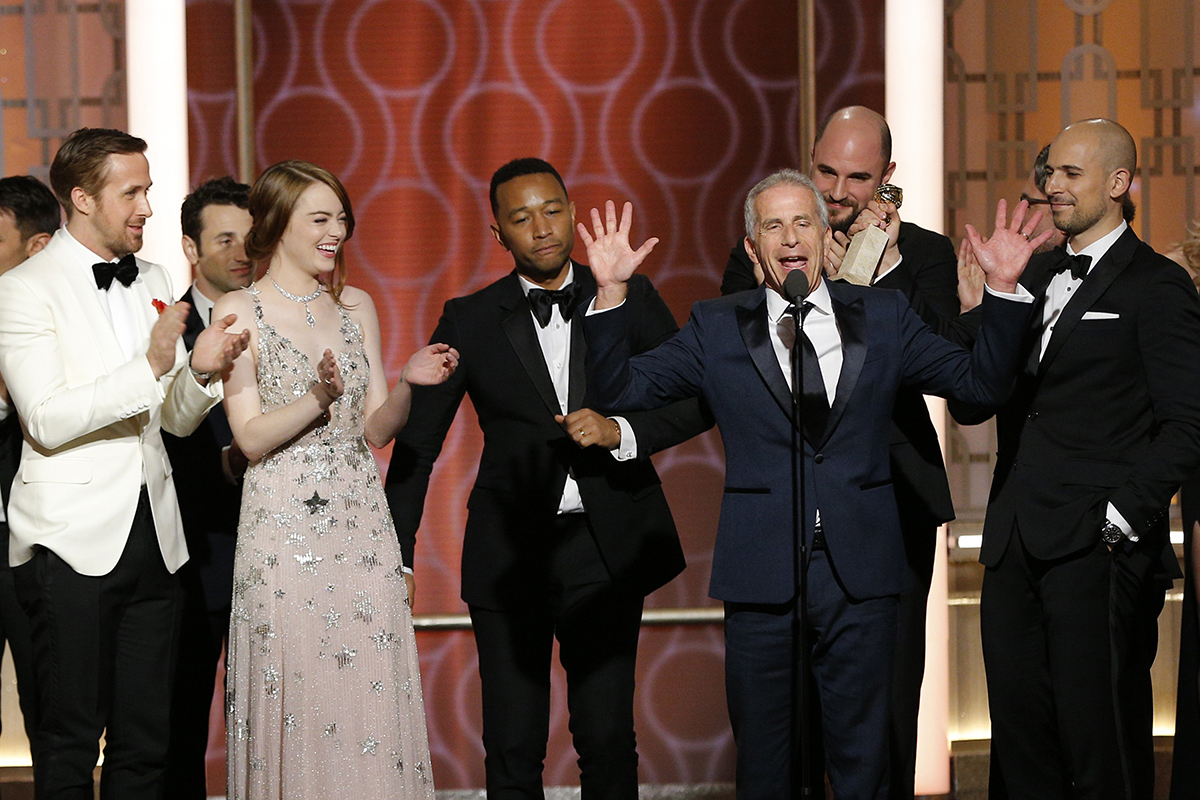 BEVERLY HILLS, CA - JANUARY 08: In this handout photo provided by NBCUniversal, (L-R) actors Ryan Gosling, Emma Stone and John Legend and producers Marc Platt, Jordan Horowitz and Fred Berger accept the award for Best Motion Picture - Musical or Comedy for "La La Land" onstage during the 74th Annual Golden Globe Awards at The Beverly Hilton Hotel on January 8, 2017 in Beverly Hills, California. (Photo by Paul Drinkwater/NBCUniversal via Getty Images)