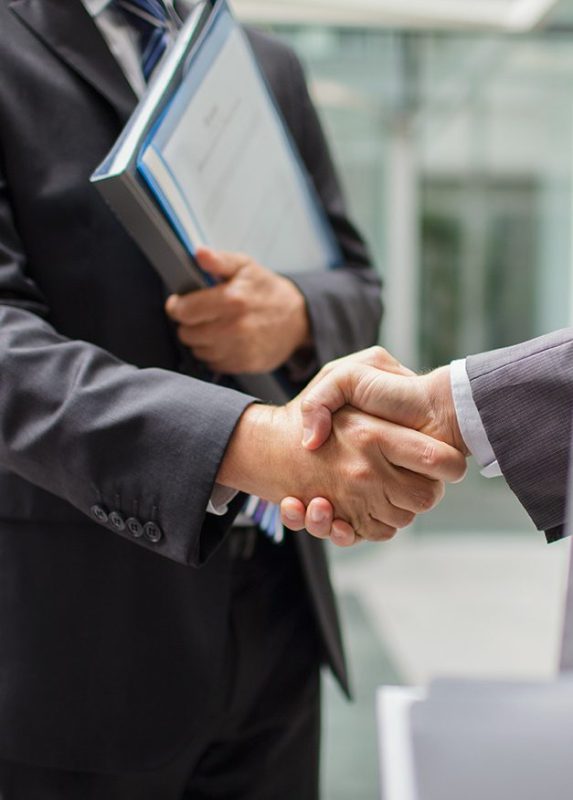 Businessmen shaking hands (Getty Images)