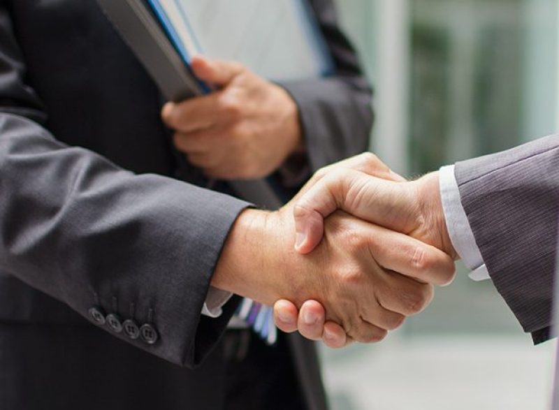 Businessmen shaking hands (Getty Images)