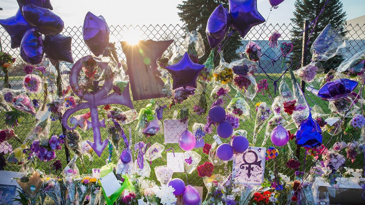 Mementos left by fans are attached to the fence which surrounds Paisley Park, the home and studio of Prince, on April 23, 2016 in Chanhassen, Minnesota. Prince, 57, was pronounced dead shortly after being found unresponsive April 21 in an elevator at Paisley Park.  (Scott Olson/Getty Images)