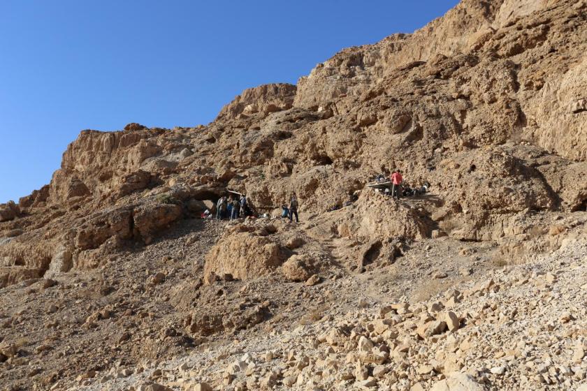 Fault cliff and entrance, on the left, to a cave near the Dead Sea, excavated by Hebrew University archaeologists, who designated it the 12th Dead Sea Scrolls cave. (Casey L. Olson and Oren Gutfeld)