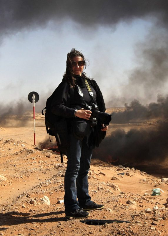 New York Times photographer Lynsey Addario stands near the frontline during a pause in the fighting March 11, 2011 in Ras Lanuf, Libya. (John Moore/Getty Images)