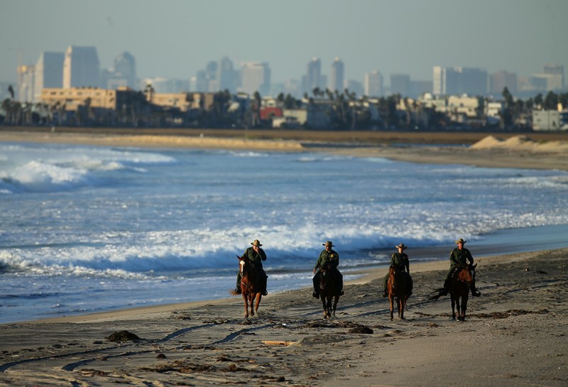 U.S. Border Patrol agents on horseback patrol along a beach just north of the U.S.-Mexico border near San Diego, California, U.S., November 10, 2016. (Mike Blake/Reuters) 