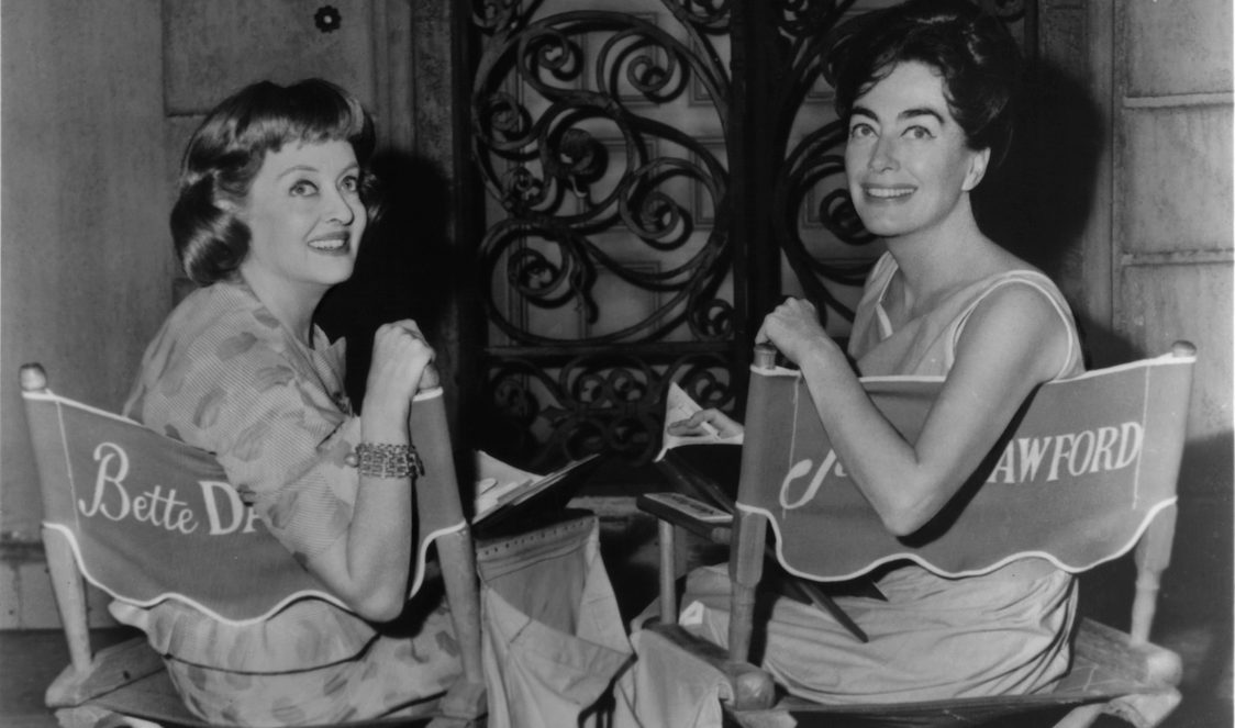 Bette Davis and Joan Crawford in between scenes from the film 'What Ever Happened To Baby Jane?', 1962. (Photo by Warner Brothers/Getty Images)