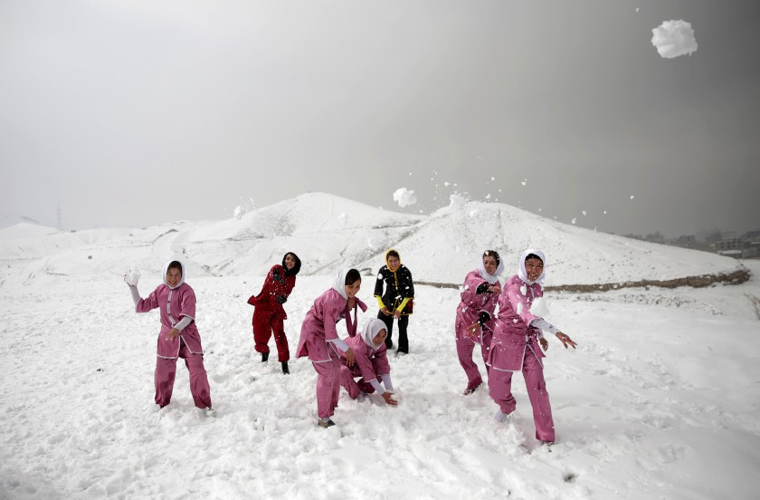 Shaolin martial arts students and their trainer have a snowball fight after their training session in Kabul, Afghanistan, Tuesday, Jan. 25, 2017. The ten ethnic Hazara women and girls practice the martial arts of Shaolin on a hilltop in the west of Kabul. They are preparing for the day that Afghanistan can send its women’s team to the Shaolin world championship in China. (AP Photos/Massoud Hossaini)