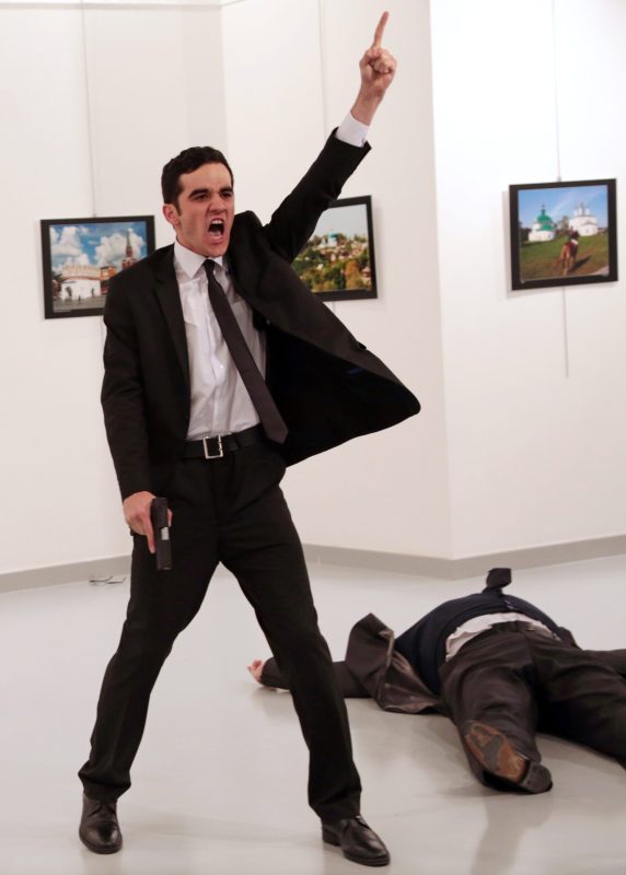 World Press Photo of the Year: Mevlut Mert Altintas shouts after shooting Andrei Karlov, right, the Russian ambassador to Turkey, at an art gallery in Ankara, Turkey, Monday, Dec. 19, 2016.  (AP Photo/Burhan Ozbilici)
