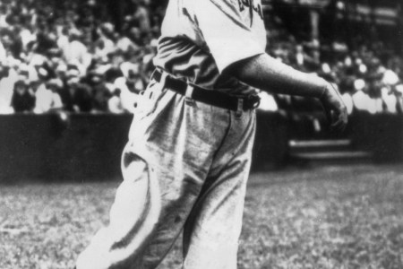 circa 1910:  Full-length portrait of American baseball player Cy Young (1867 - 1955), pitcher for the Cleveland Naps, lightly tossing a ball during warm-ups while wearing his uniform.  (Photo by Photo File/Getty Images)
