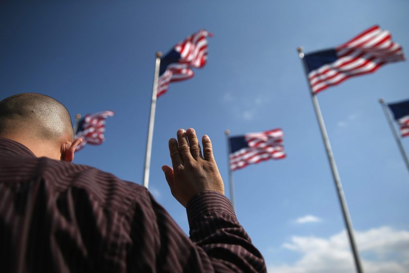 Immigrants take the oath of citizenship to the United States during a naturalization ceremony at Liberty State Park on September 19, 2014 in Jersey City, New Jersey. (John Moore/Getty Images)