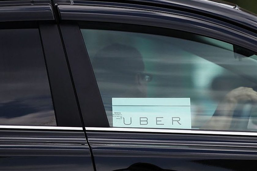 An Uber vehicle is viewed in Manhattan on July 20, 2015 in New York City. New York's City Council has proposed two bills last month to limit the number of new for-hire vehicles, as well as to study the rapidly rising industry's impact on traffic. Uber has responded in an open letter arguing that its 6,000 Uber cars out during an average hour are a small part of the city's overall traffic. In cities across the globe Uber has upended the traditional taxi concept with many drivers and governments taking action against the California based company. (Spencer Platt/Getty Images)