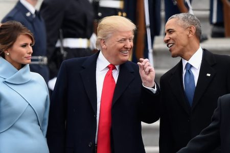 US First Lady Melania Trump looks on as US President Donald Trump and former President Barack Obama talk on the East front steps of the US Capitol after inauguration ceremonies on January 20, 2017 in Washington, DC.  / AFP / Robyn BECK        (Photo credit should read ROBYN BECK/AFP/Getty Images)