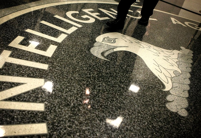 A man walks across the seal of the Central Intelligence Agency at the lobby of the Original Headquarters Building at the CIA headquarters February 19, 2009 in McLean, Virginia. (Alex Wong/Getty Images)