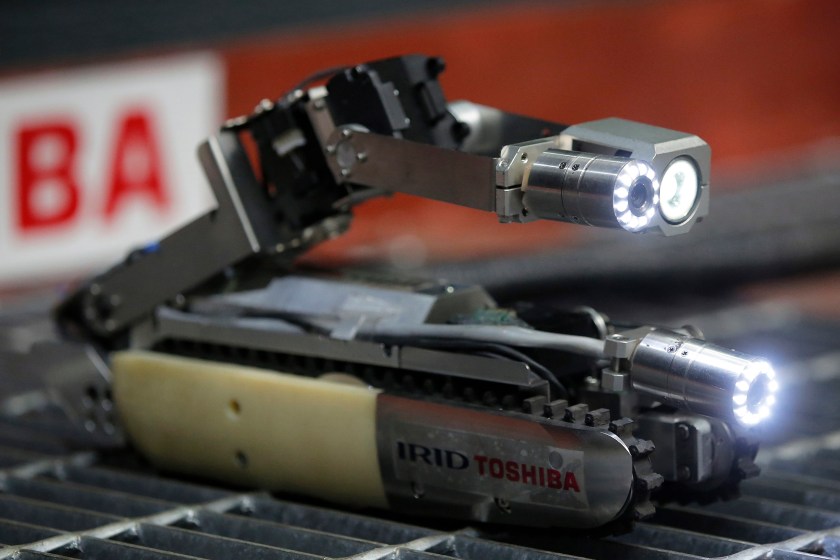 Toshiba Corp.'s small robot, co-developed with the International Research Institute for Nuclear Decommissioning (IRID), operates during a demonstration at Toshiba's Keihin Product Operations in Yokohama, Kanagawa Prefecture, Japan, on Tuesday, June 30, 2015. Toshiba unveiled the robot which was developed for the investigation of Primary Containment Vessel (PCV) interiors of Unit No.2 at Tokyo Electric Power Co.'s (Tepco) Fukushima Dai-ichi nuclear power plant. Photographer: Kiyoshi Ota/Bloomberg via Getty Images