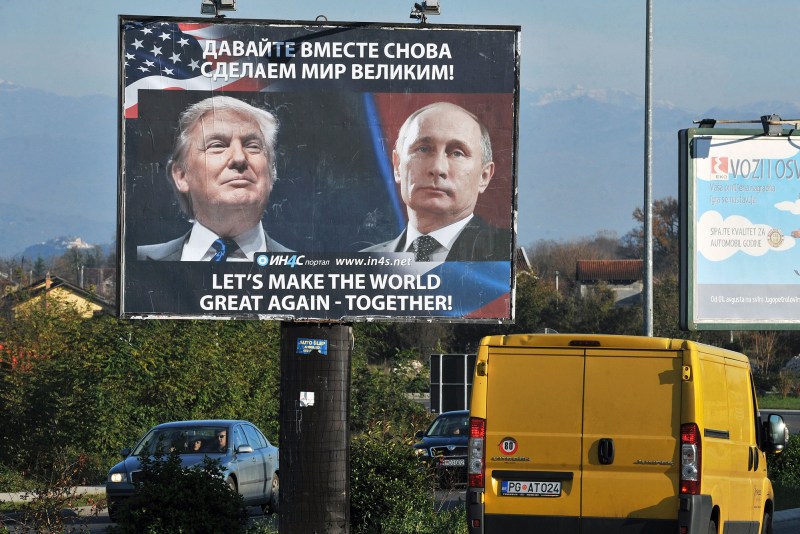 Cars pass by a billboard showing US President-elect Donald Trump and Russian President Vladimir Putin placed by pro-Serbian movement in the town of Danilovgrad on November 16, 2016. Russian President Vladimir Putin and Donald Trump spoke on the phone on November 15, evening and agreed on the need to normalise ties between Washington and Moscow, the Kremlin said. Savo Prelevic/AFP/Getty Images)