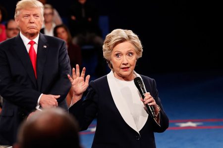 ST LOUIS, MO - OCTOBER 09:  Democratic presidential nominee former Secretary of State Hillary Clinton (R) speaks as Republican presidential nominee Donald Trump listens during the town hall debate at Washington University on October 9, 2016 in St Louis, Missouri. This is the second of three presidential debates scheduled prior to the November 8th election.  (Photo by Rick Wilking-Pool/Getty Images)