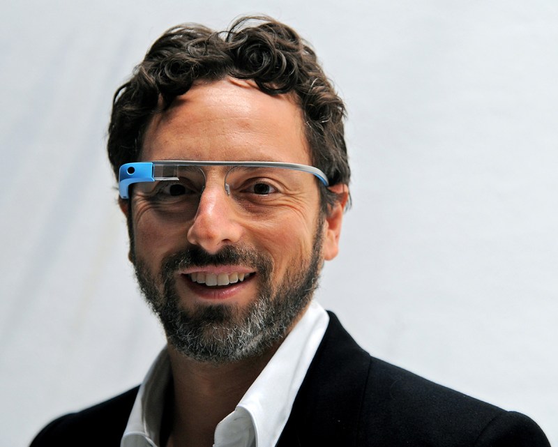 Sergey Brin, co-founder of Google Inc., stands for a photograph while wearing Project Glass internet glasses at the Diane Von Furstenberg fashion show in New York, U.S., on Sunday, Sept. 9, 2012. Google Inc., owner of the world’s most popular search engine, will sell eyeglass-embedded computers to consumers by 2014 after incorporating feedback from developers, said Brin. Photographer: Peter Foley/Bloomberg via Getty Images