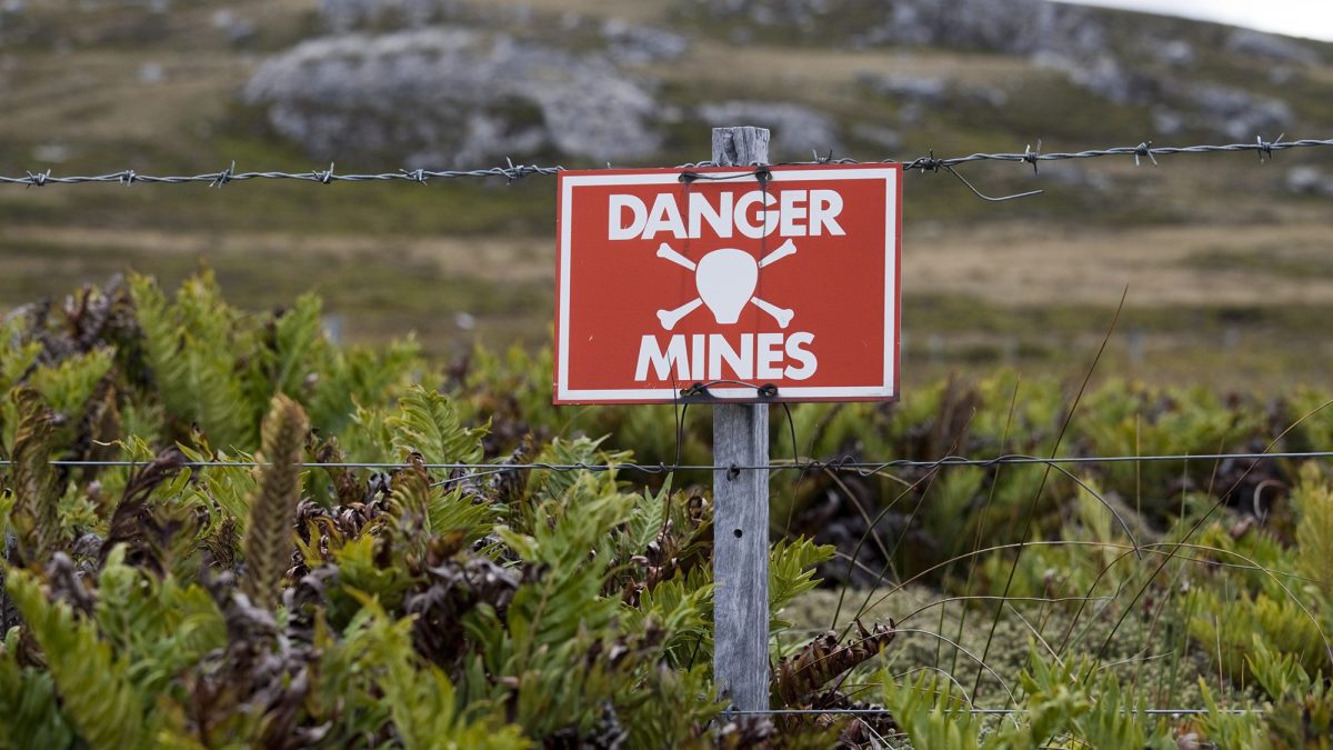 A warning sign marking one of the areas on the Falkland Islands still not cleared of mines planted by the Argentinian forces during the invasion of 1982. (Getty Images)