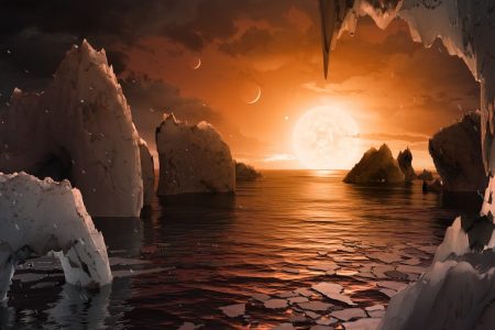 UNSPECIFIED:  In this NASA digital illustration handout released on February 22, 2017, an artist's concept allows us to imagine what it would be like to stand on the surface of the exoplanet TRAPPIST-1f, located in the TRAPPIST-1 system in the constellation Aquarius. Because this planet is thought to be tidally locked to its star, meaning the same face of the planet is always pointed at the star, there would be a region called the terminator that perpetually divides day and night. If the night side is icy, the day side might give way to liquid water in the area where sufficient starlight hits the surface. One of the unusual features of TRAPPIST-1 planets is how close they are to each other -- so close that other planets could be visible in the sky from the surface of each one. In this view, the planets in the sky correspond to TRAPPIST1e (top left crescent), d (middle crescent) and c (bright dot to the lower right of the crescents). TRAPPIST-1e would appear about the same size as the moon and TRAPPIST1-c is on the far side of the star. The star itself, an ultra-cool dwarf, would appear about three times larger than our own sun does in Earth's skies.
The system has been revealed through observations from NASA's Spitzer Space Telescope as well as other ground-based observatories, and the ground-based TRAPPIST telescope for which it was named after. (Photo digital Illustration by NASA/NASA via Getty Images)