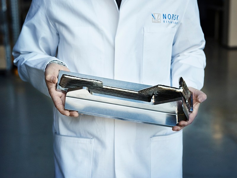 A Norsk Titanium Scientist Displays a Boeing 787 Dreamliner Structural Component, the World's First FAA-Approved 3D-Printed Part (Norsk Titanium AS)