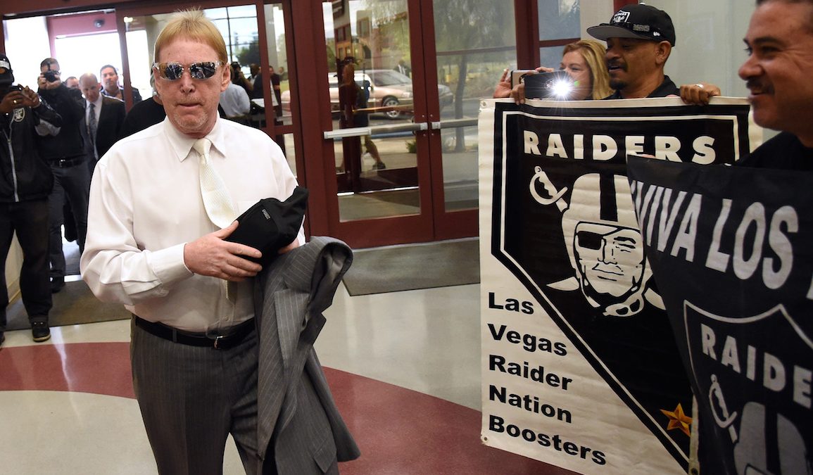 LAS VEGAS, NV - APRIL 28:  Oakland Raiders owner Mark Davis walks past fans holding Raiders signs as he arrives at a Southern Nevada Tourism Infrastructure Committee meeting at UNLV on April 28, 2016 in Las Vegas, Nevada. Davis told the committee he is willing to spend USD 500 million as part of a deal to move the team to Las Vegas if a proposed USD 1.3 billion, 65,000-seat domed stadium is built by casino magnate Sheldon Adelson's Las Vegas Sands Corp. and real estate agency Majestic Realty, possibly on a vacant 42-acre lot a few blocks east of the Las Vegas Strip recently purchased by UNLV.  (Photo by Ethan Miller/Getty Images)