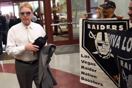 LAS VEGAS, NV - APRIL 28:  Oakland Raiders owner Mark Davis walks past fans holding Raiders signs as he arrives at a Southern Nevada Tourism Infrastructure Committee meeting at UNLV on April 28, 2016 in Las Vegas, Nevada. Davis told the committee he is willing to spend USD 500 million as part of a deal to move the team to Las Vegas if a proposed USD 1.3 billion, 65,000-seat domed stadium is built by casino magnate Sheldon Adelson's Las Vegas Sands Corp. and real estate agency Majestic Realty, possibly on a vacant 42-acre lot a few blocks east of the Las Vegas Strip recently purchased by UNLV.  (Photo by Ethan Miller/Getty Images)