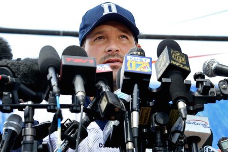 Dallas Cowboys quarterback Tony Romo is behind a wall of microphones during his media availability after the team's morning walk through during training camp in Oxnard, Calif., on Thursday, July 30, 2015. (Paul Moseley/Fort Worth Star-Telegram/TNS via Getty Images)