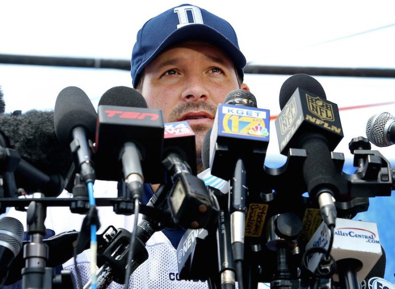 Dallas Cowboys quarterback Tony Romo is behind a wall of microphones during his media availability after the team's morning walk through during training camp in Oxnard, Calif., on Thursday, July 30, 2015. (Paul Moseley/Fort Worth Star-Telegram/TNS via Getty Images)