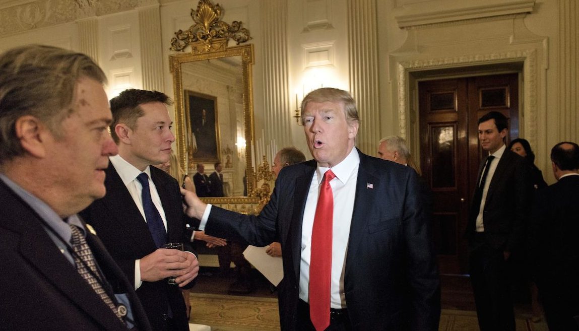 Trump advisor Steve Bannon (L) watches as US President Donald Trump greets Elon Musk, SpaceX and Tesla CEO, before a policy and strategy forum with executives in the State Dining Room of the White House February 3, 2017 in Washington, DC. / AFP / Brendan Smialowski        (Photo credit should read BRENDAN SMIALOWSKI/AFP/Getty Images)