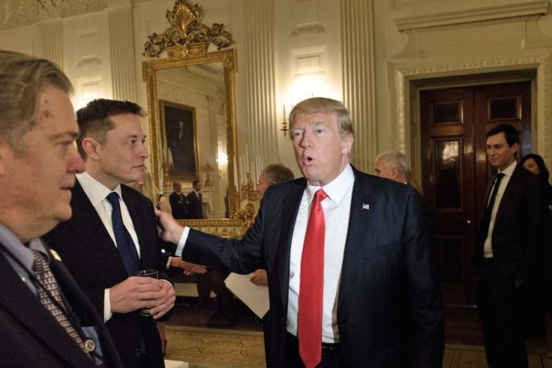 Trump advisor Steve Bannon (L) watches as US President Donald Trump greets Elon Musk, SpaceX and Tesla CEO, before a policy and strategy forum with executives in the State Dining Room of the White House February 3, 2017 in Washington, DC. / AFP / Brendan Smialowski (Photo credit should read BRENDAN SMIALOWSKI/AFP/Getty Images)