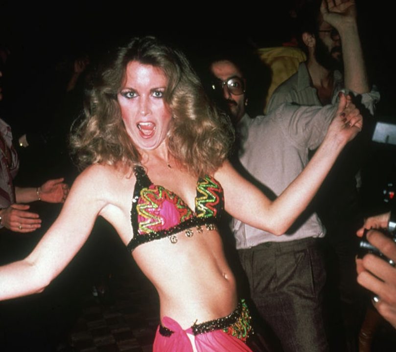 An unidentified party-goer dances in a bikini and transparent skirt at the nightclub Studio 54, New York, New York, late 1970s or early 1980s. (Photo by Rose Hartman/Getty Images)