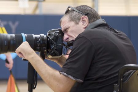 Photographer Loren Worthington taking photos of para-athletes.