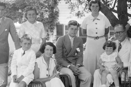 A portrait of the Kennedy family,  1930s. Seated from left are: Patricia Kennedy, Robert Kennedy, Rose Kennedy, John F Kennedy, Joseph P Kennedy Sr with Edward Kennedy on his lap; standing from left are: Joseph P Kennedy Jr, Kathleen Kennedy, Rosemary Kennedy, Eunice Kennedy (rear, in polka dots), and Jean Kennedy. (Bachrach/Getty Images)