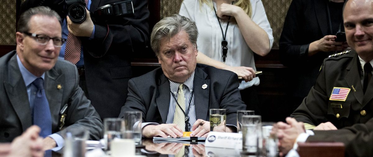 WASHINGTON, DC - FEBRUARY 7:  (AFP OUT) Steve Bannon, chief strategist for U.S. President Donald Trump, center, listens during a county sheriff listening session with Trump, not pictured, in the Roosevelt Room of the White House on February 7, 2017 in Washington, DC. The Trump administration will return to court Tuesday to argue it has broad authority over national security and to demand reinstatement of a travel ban on seven Muslim-majority countries that stranded refugees and triggered protests. (Photo by Andrew Harrer - Pool/Getty Images)