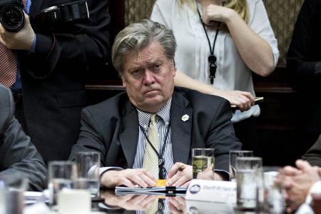 WASHINGTON, DC - FEBRUARY 7:  (AFP OUT) Steve Bannon, chief strategist for U.S. President Donald Trump, center, listens during a county sheriff listening session with Trump, not pictured, in the Roosevelt Room of the White House on February 7, 2017 in Washington, DC. The Trump administration will return to court Tuesday to argue it has broad authority over national security and to demand reinstatement of a travel ban on seven Muslim-majority countries that stranded refugees and triggered protests. (Photo by Andrew Harrer - Pool/Getty Images)