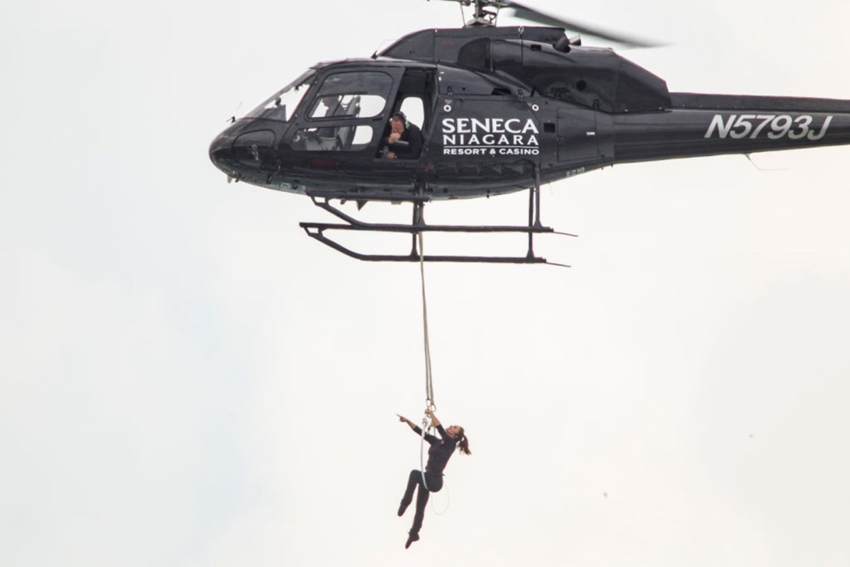 Aerialist Erendira Wallenda hangs beneath a helicopter during a stunt over the Horseshoe Falls at Niagara Falls, New York, June 15, 2017.