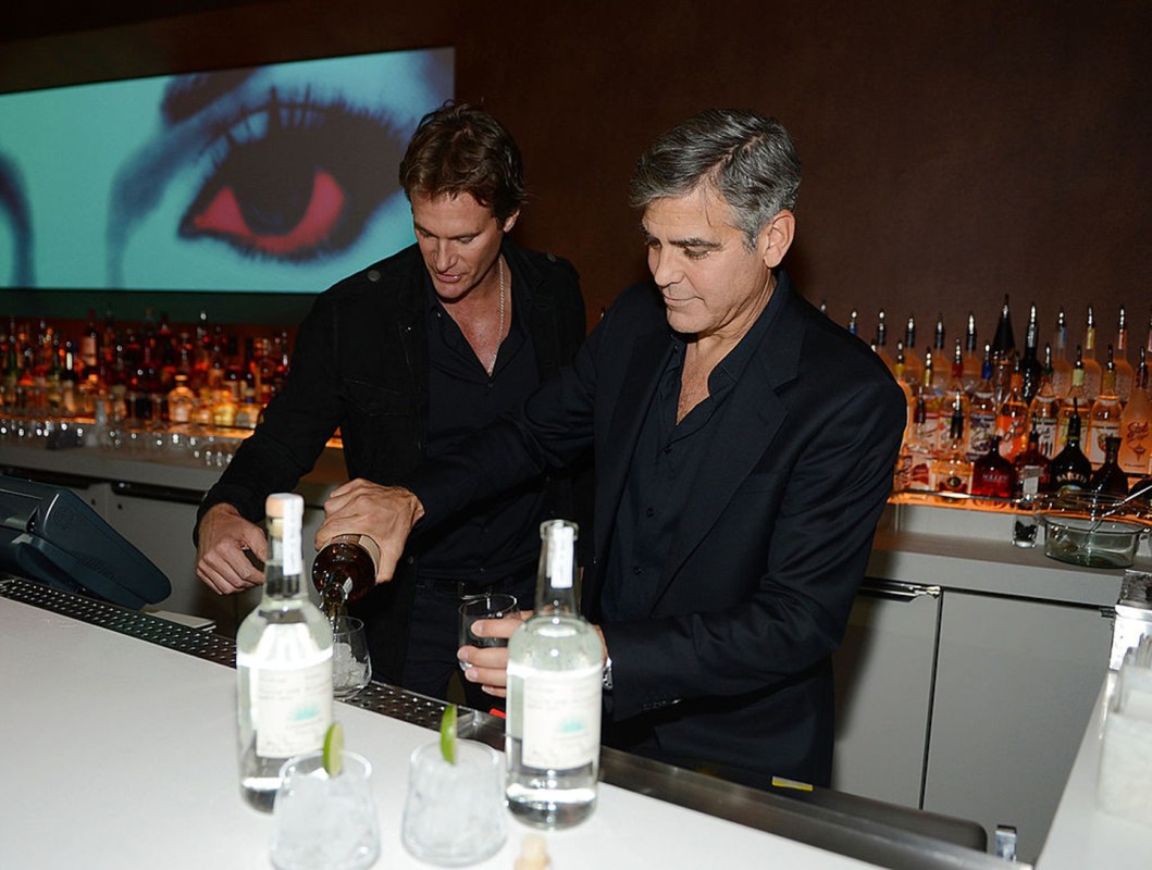 Casamigos Tequila founders Rande Gerber and George Clooney celebrate the launch of Casamigos at Andrea's at Encore Las Vegas on January 9, 2013 in Las Vegas, Nevada.