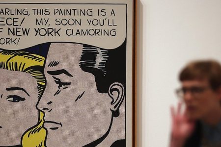 A visitor stands in front of a painting entitled 'Masterpiece,' during a press preview of 'Lichtenstein, a Retrospective' at the Tate Modern on February 18, 2013 in London, England. Steve Cohen just bought this painting for $165 million.