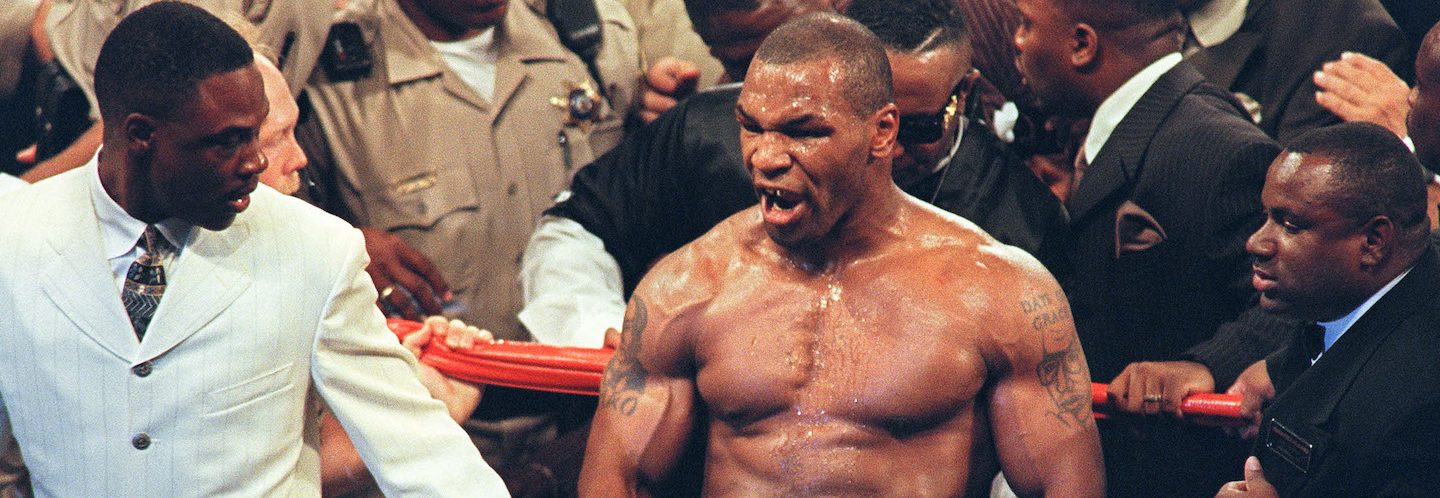 Mike Tyson reacts after being disqualified at the end of the third round of...