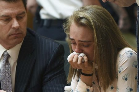 Michelle Carter cries while flanked by defense attorneys Joseph Cataldo, left, and Cory Madera, after being found guilty of involuntary manslaughter in the suicide of Conrad Roy III, Friday, June 16, 2017, in Bristol Juvenile Court in Taunton, Mass.