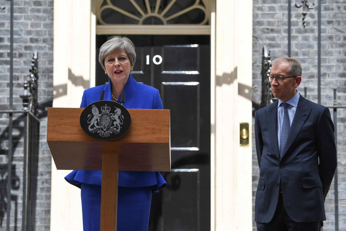 Britain's Prime Minister and leader of the Conservative Party Theresa May, accompanied by her husband Philip, delivers a statement outside 10 Downing Street in central London on June 9, 2017 as results from a snap general election show the Conservatives have lost their majority. British Prime Minister Theresa May said Friday she planned to stick to the timetable for starting Brexit negotiations in 10 days, with a new government that would lead Britain out of the EU. (Justin Tallis/AFP/Getty Images)