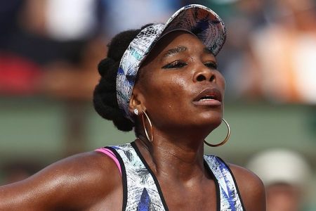 Venus Williams of the United States reacts in her women's singles fourth round match against Timea Bacsinszky of Switzerland during day eight of the French Open at Roland Garros on June 4, 2017 in Paris, France.