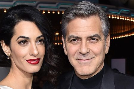 Amal Clooney, left, and George Clooney arrive at the world premiere of "Hail, Caesar!" in Los Angeles. The two wed on Sept. 27, 2014, in Venice, Italy. (Photo by Jordan Strauss/Invision/AP, File)