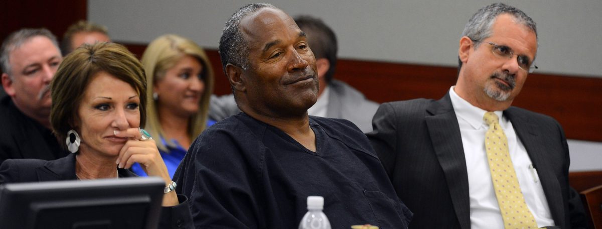  O.J. Simpson (C) and his defense attorneys Patricia Palm (L) and Ozzie Fumo (R) listen during an evidentiary hearing in Clark County District Court on May 17, 2013 in Las Vegas, Nevada. Simpson, who is currently serving a nine-to-33-year sentence in state prison as a result of his October 2008 conviction for armed robbery and kidnapping charges, is using a writ of habeas corpus to seek a new trial, claiming he had such bad representation that his conviction should be reversed.  (Photo by Ethan Miller/Getty Images)